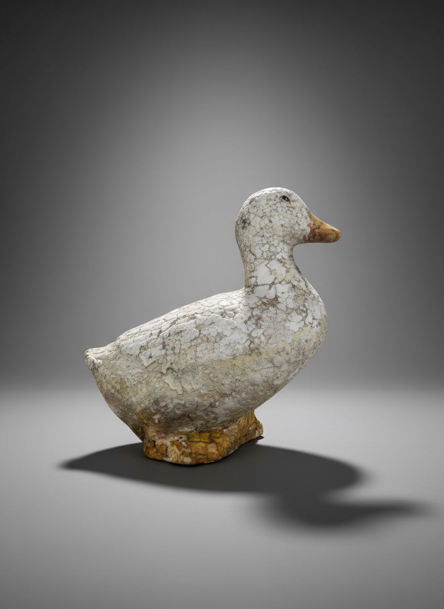 Weathered Vintage Concrete Duck Garden Sculpture – Rustic Folk Art Décor, showcasing its charming aged look and rustic appeal. hommes + gardens estudio.