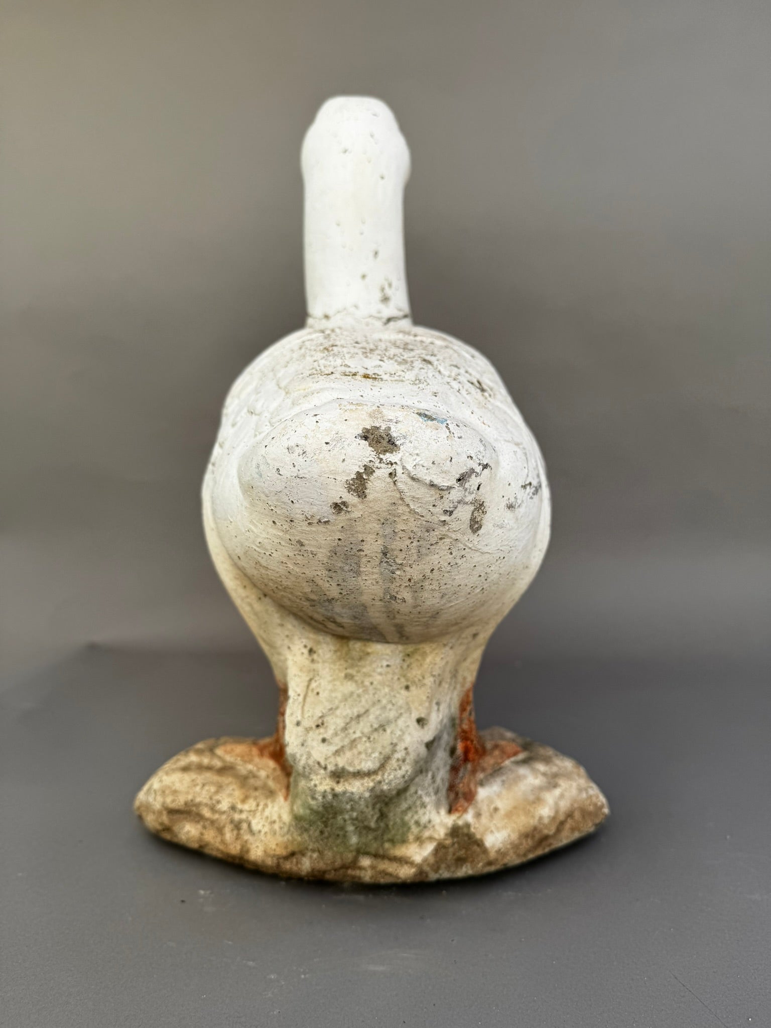 Vintage Handcrafted Concrete Duck Garden Sculpture – Rustic Outdoor Decor showcasing the back view of the charming duck statue. hommes + gardens estudio.