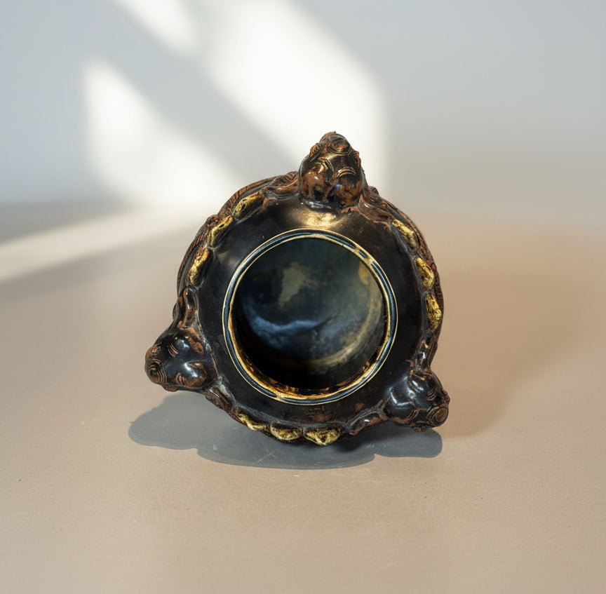 Antique Elephant Motif Ceramic Vessel with Gilded Accents showcasing detailed craftsmanship and unique design. hommes + gardens estudio.