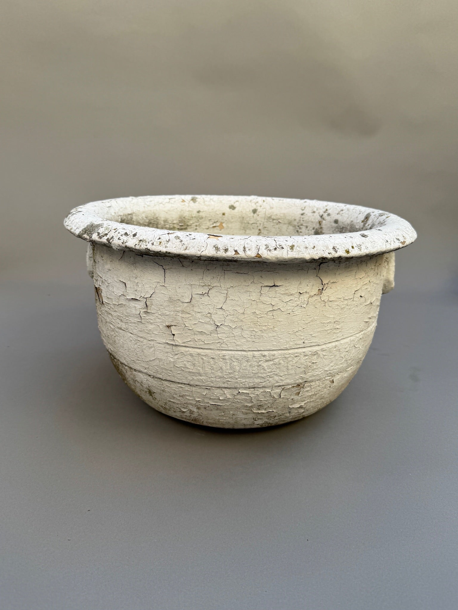 Antique European Terracotta Planter with Aged White Patina, featuring a crackled surface and rustic charm. hommes + gardens estudio.