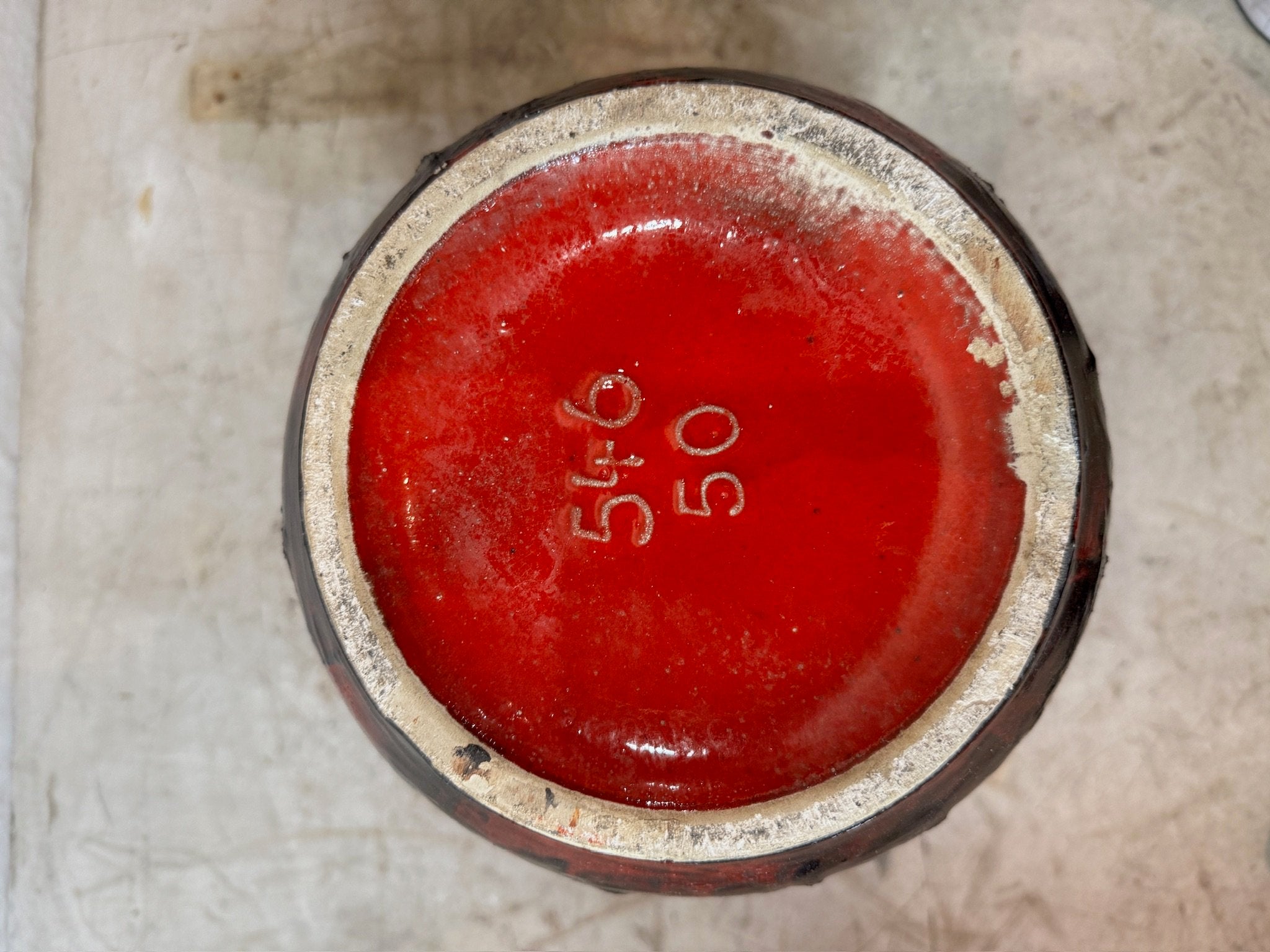 Bottom view of West German Red Fat Lava Horses Vase by Scheurich, 1960s showing signature 546-50, hommes + gardens estudio.