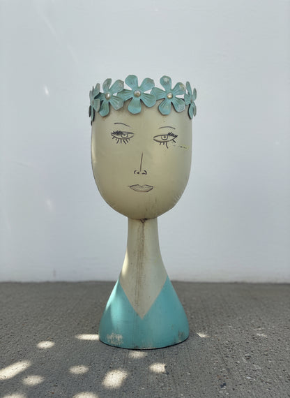Whimsical mid-century modern metal female bust planter with aqua floral crown and hand-painted folk art details — Hommes and Gardens, Home Decor Collection, landscape design, plant design, Landscape Architect, Interior Designer, Outdoor Living, Outdoor Decorations, Home Design, Luxury Design, Art, Furniture, Objects, Best Gifts, Nature, Backyard, Yard.