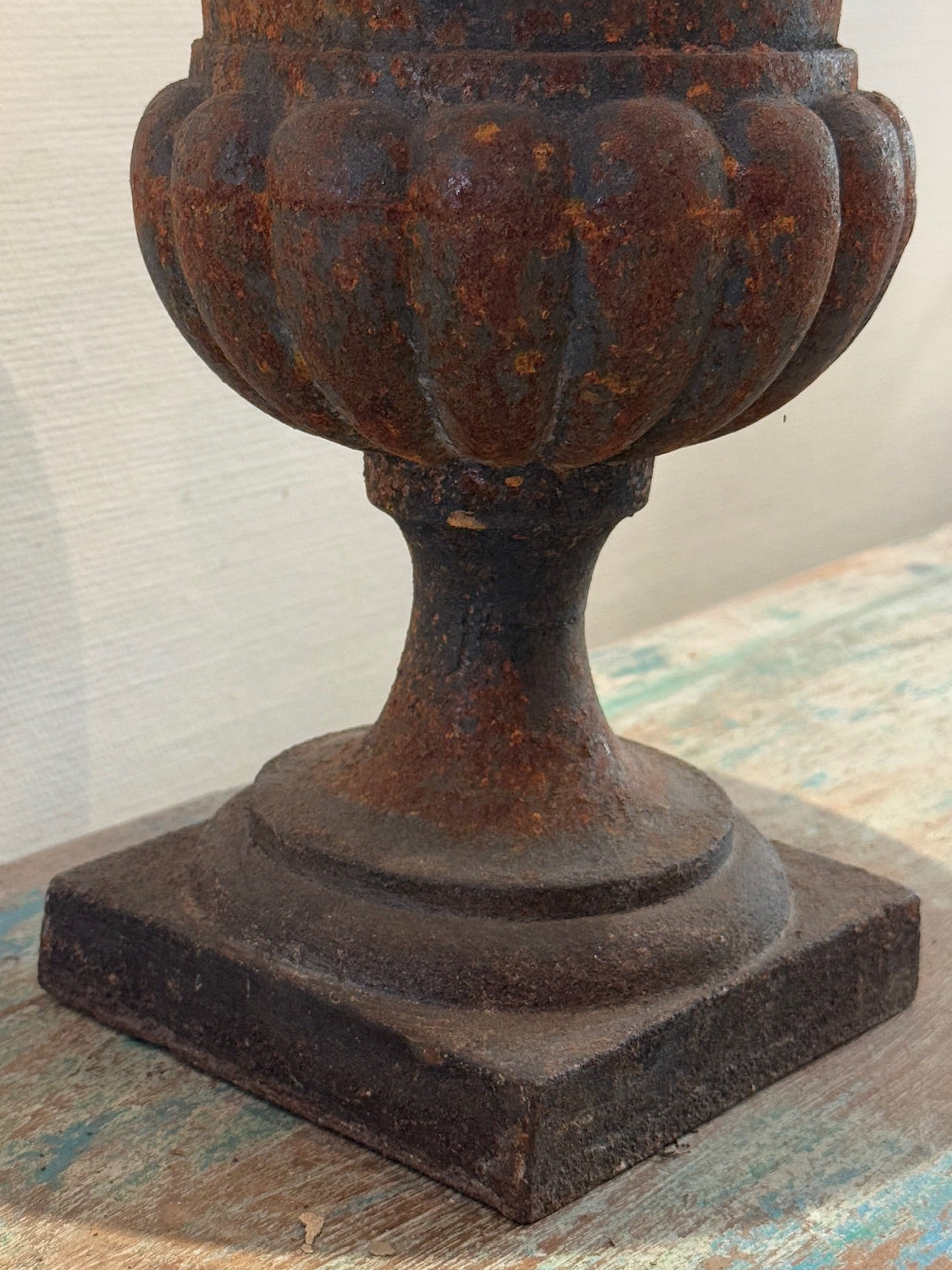 Antique French Neoclassical Cast Iron Mini Urn Planter – Aged Patina showcasing fluted design and rust patina. hommes + gardens estudio.