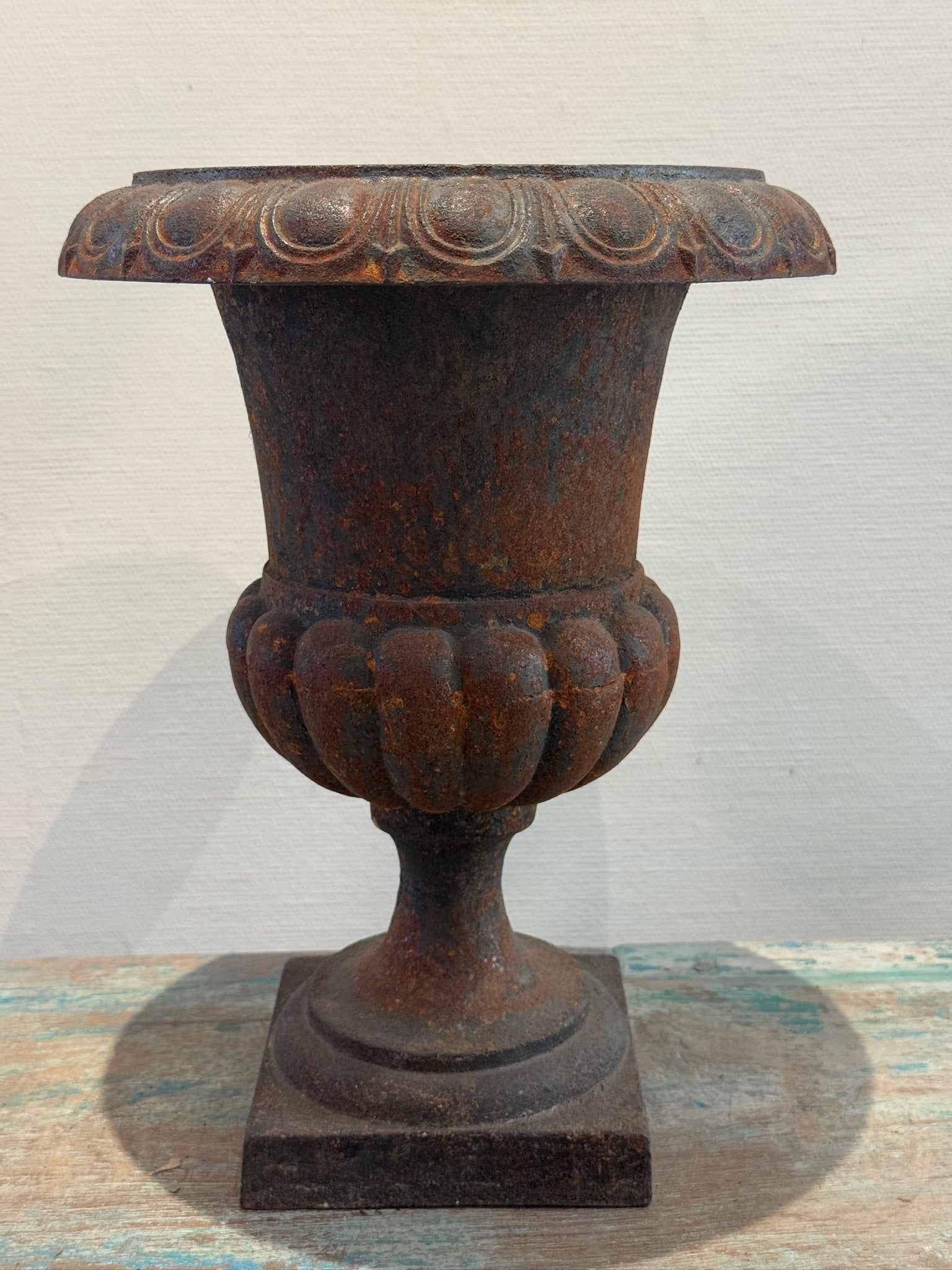 Antique French Neoclassical Cast Iron Mini Urn Planter – Aged Patina showcasing fluted design and rust patina. hommes + gardens estudio.