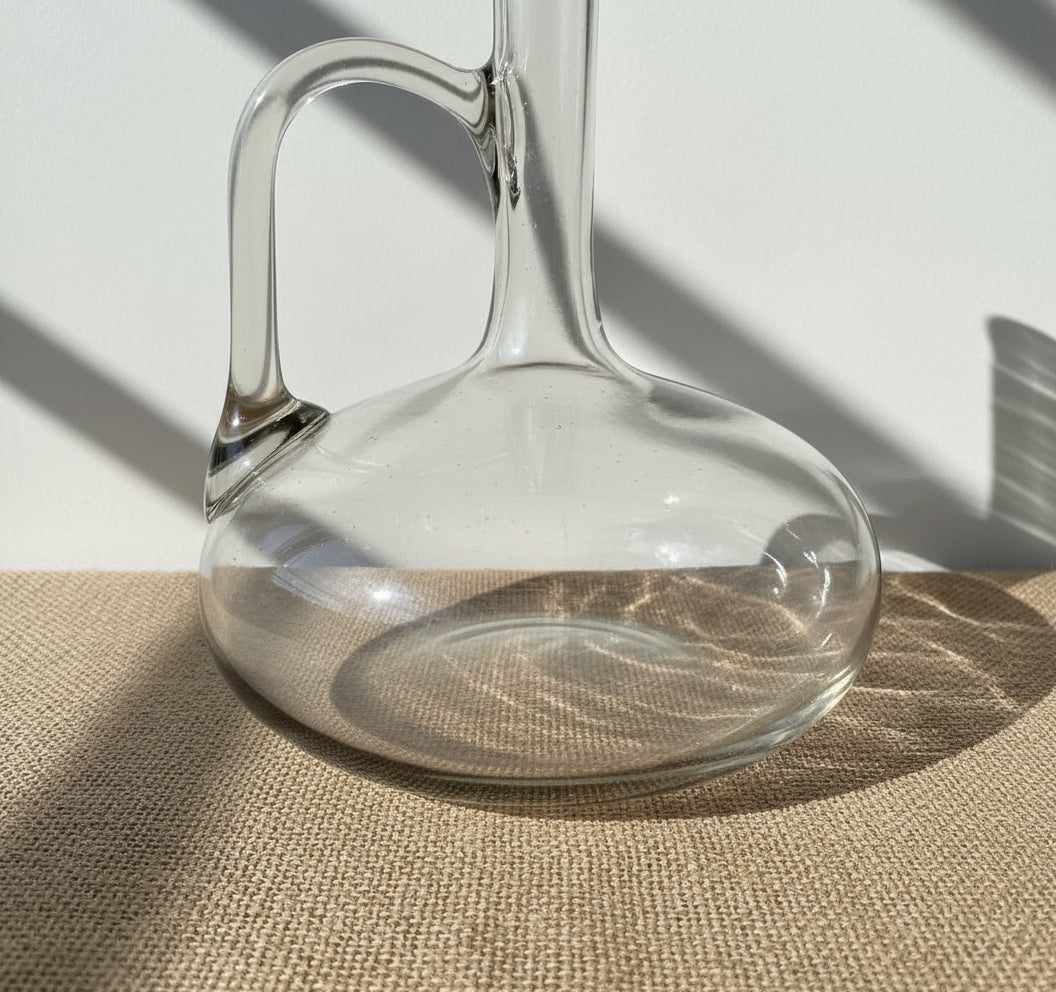 Mid-Century French Hand-Blown Smoke Glass Wine Decanter with Sculptural Handle close-up view of base and handle. hommes + gardens estudio