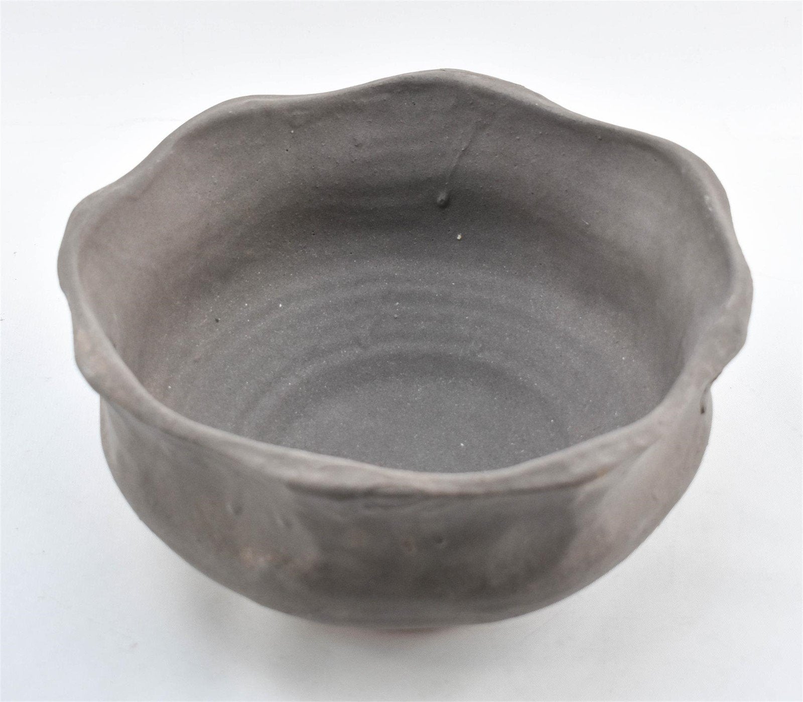 Gray clay bowl with painted finish and irregular rim, signed by the artist, a handcrafted pottery piece for stylish interiors — Hommes and Gardens, Catchall Collection, home decor, outdoor decorations, home design, luxury design, Landscape Architect, Interior Designer, Outdoor Living, Art, Furniture, Objects, Best Gifts, Nature, Backyard, Yard.