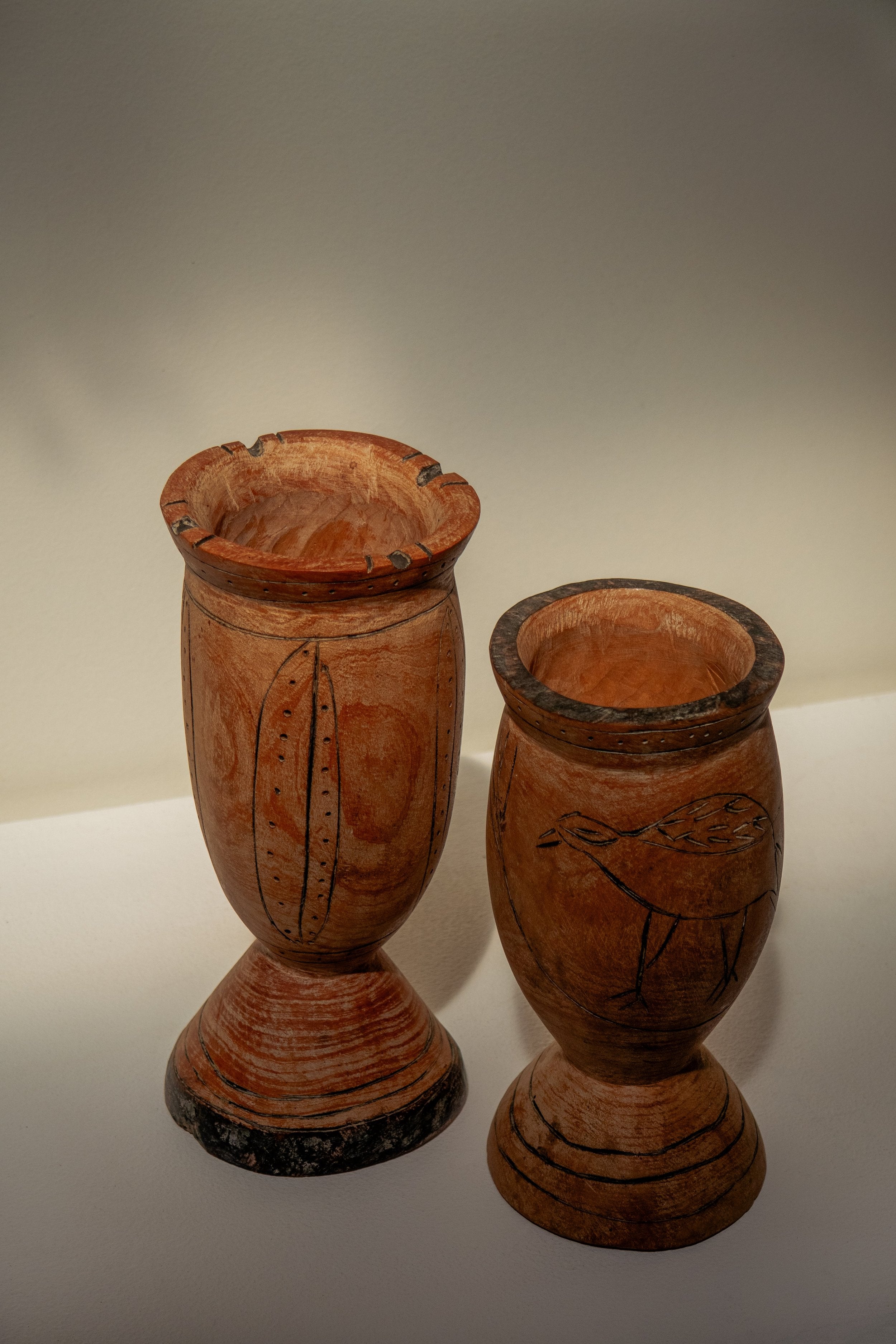 Pair of Vintage Wooden Goblets with Hand Carved Primitive Illustrations, showcasing unique engravings. hommes + gardens estudio.