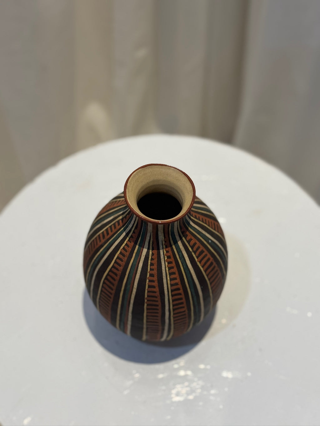 Hand-painted vintage tribal ceramic vase featuring geometric patterns in earthy hues of terracotta and black, reflecting Latin American artistry — Hommes and Gardens, Vases + Vessels Collection, Landscape Architect, Interior Designer, Outdoor Living, Art, Furniture, Objects, Best Gifts, Nature, Backyard, Yard, Outdoor Decorations, Home Decor, Home Design, Luxury Design.