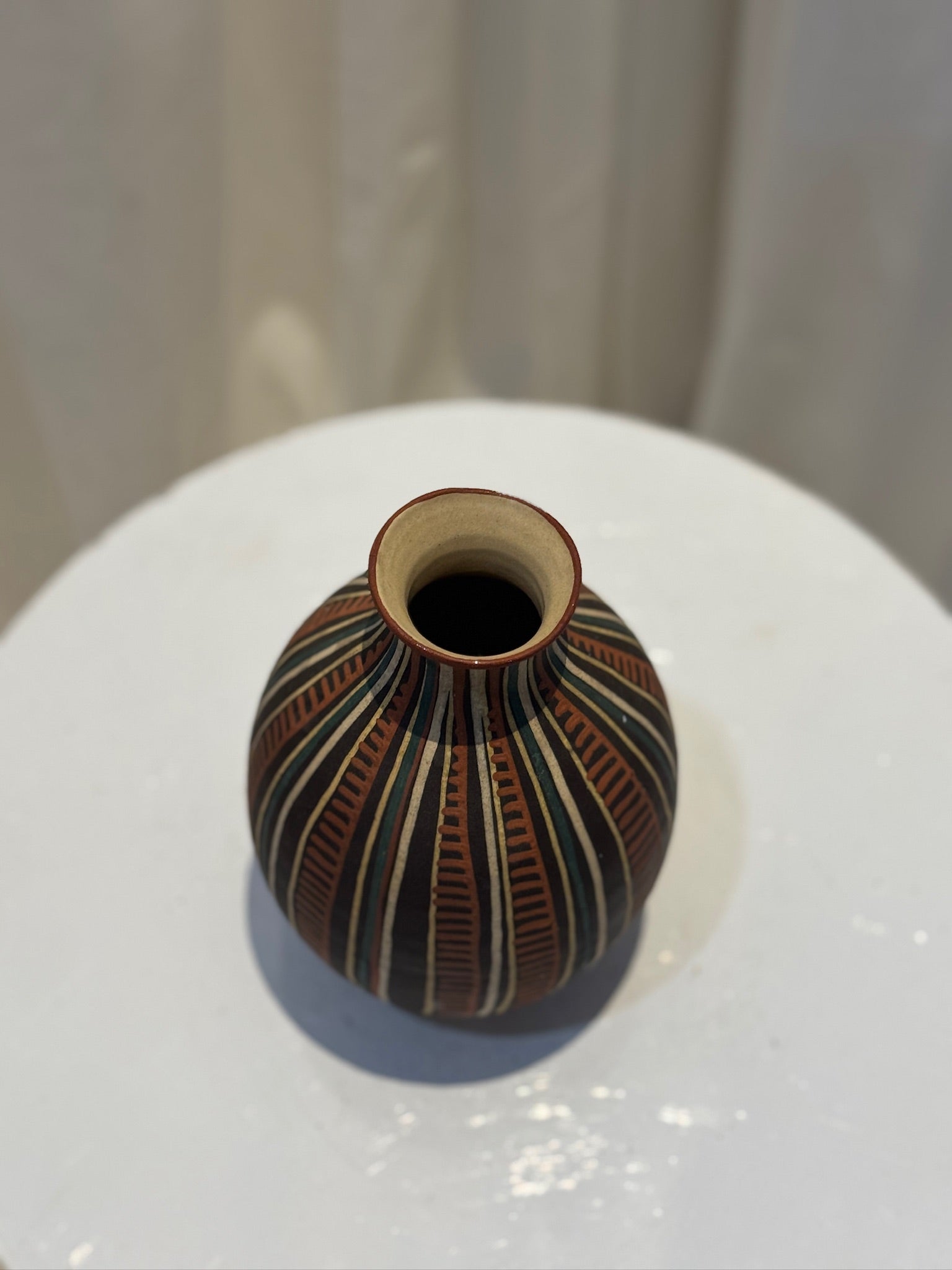 Hand-painted vintage tribal ceramic vase featuring geometric patterns in earthy hues of terracotta and black, reflecting Latin American artistry — Hommes and Gardens, Vases + Vessels Collection, Landscape Architect, Interior Designer, Outdoor Living, Art, Furniture, Objects, Best Gifts, Nature, Backyard, Yard, Outdoor Decorations, Home Decor, Home Design, Luxury Design.