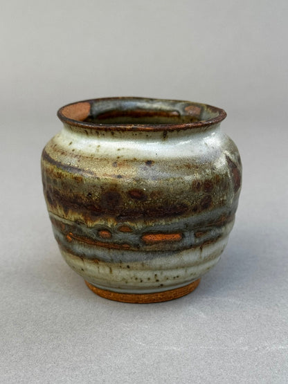 Hand-thrown ceramic urn vase signed P.S.E. with layered ash glaze in brown, gray, and terracotta tones, organic studio pottery design — Hommes and Gardens, Home Decor Collection, landscape design, plant design, Landscape Architect, Interior Designer, Outdoor Living, Outdoor Decorations, Home Design, Luxury Design, Art, Furniture, Objects, Best Gifts, Nature, Backyard, Yard.