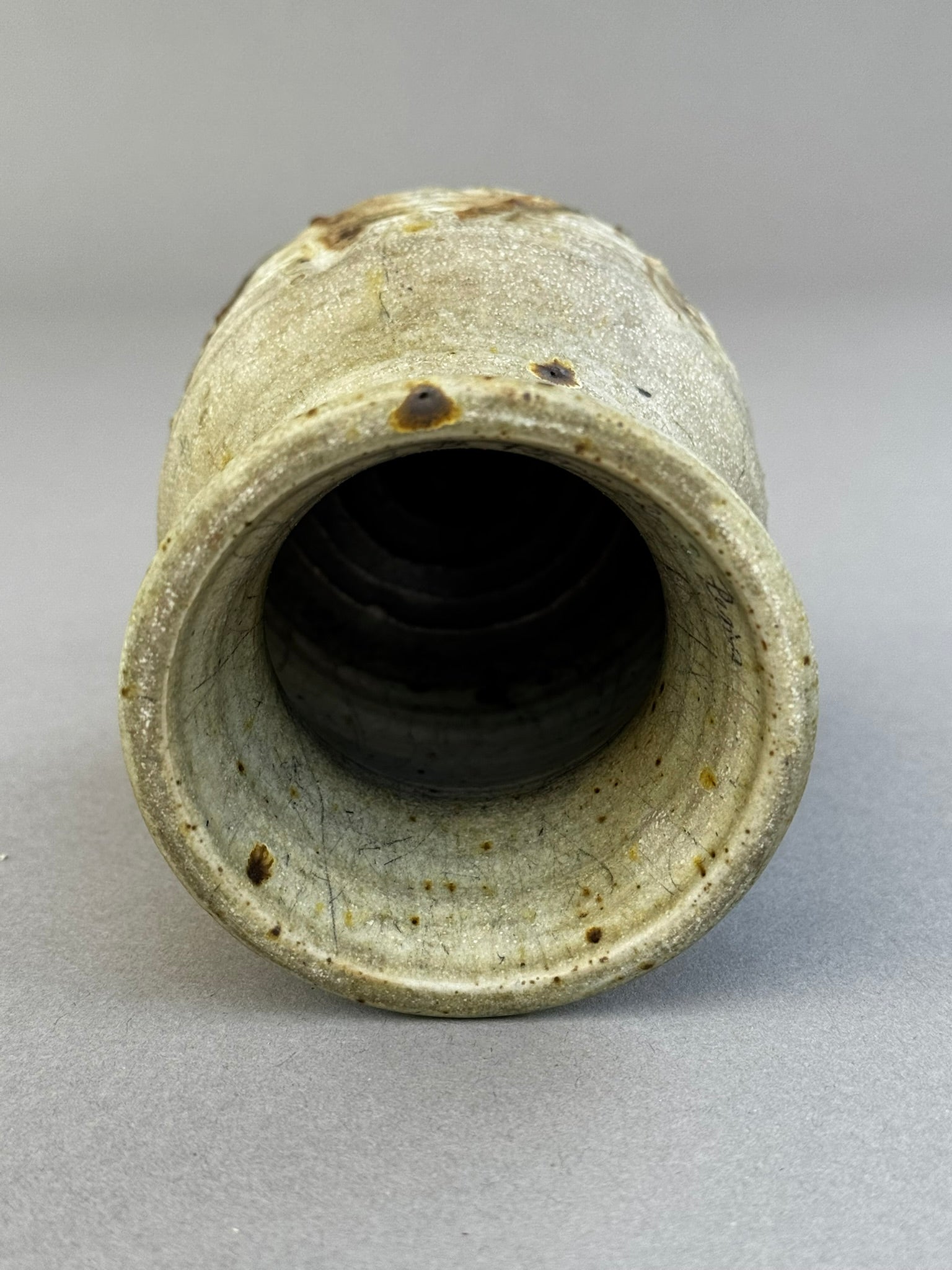Interior view of the Signed Studio Pottery Vase by "AGE" – Hand-Thrown Glazed Ceramic Art, showcasing its unique texture. hommes + gardens estudio.