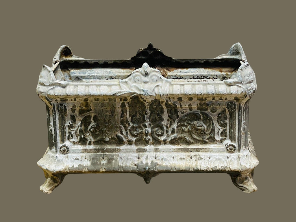 Handcrafted antique French cast iron urn planter with clawed feet, ornamental reliefs, and distressed paint patina for a classic European garden look — Hommes and Gardens, Pots + Planters Collection, Landscape Architect, Interior Designer, Outdoor Living, Art, Furniture, Objects, Best Gifts, Nature, Backyard, Yard, Outdoor Decorations, Home Decor, Home Design, Luxury Design.