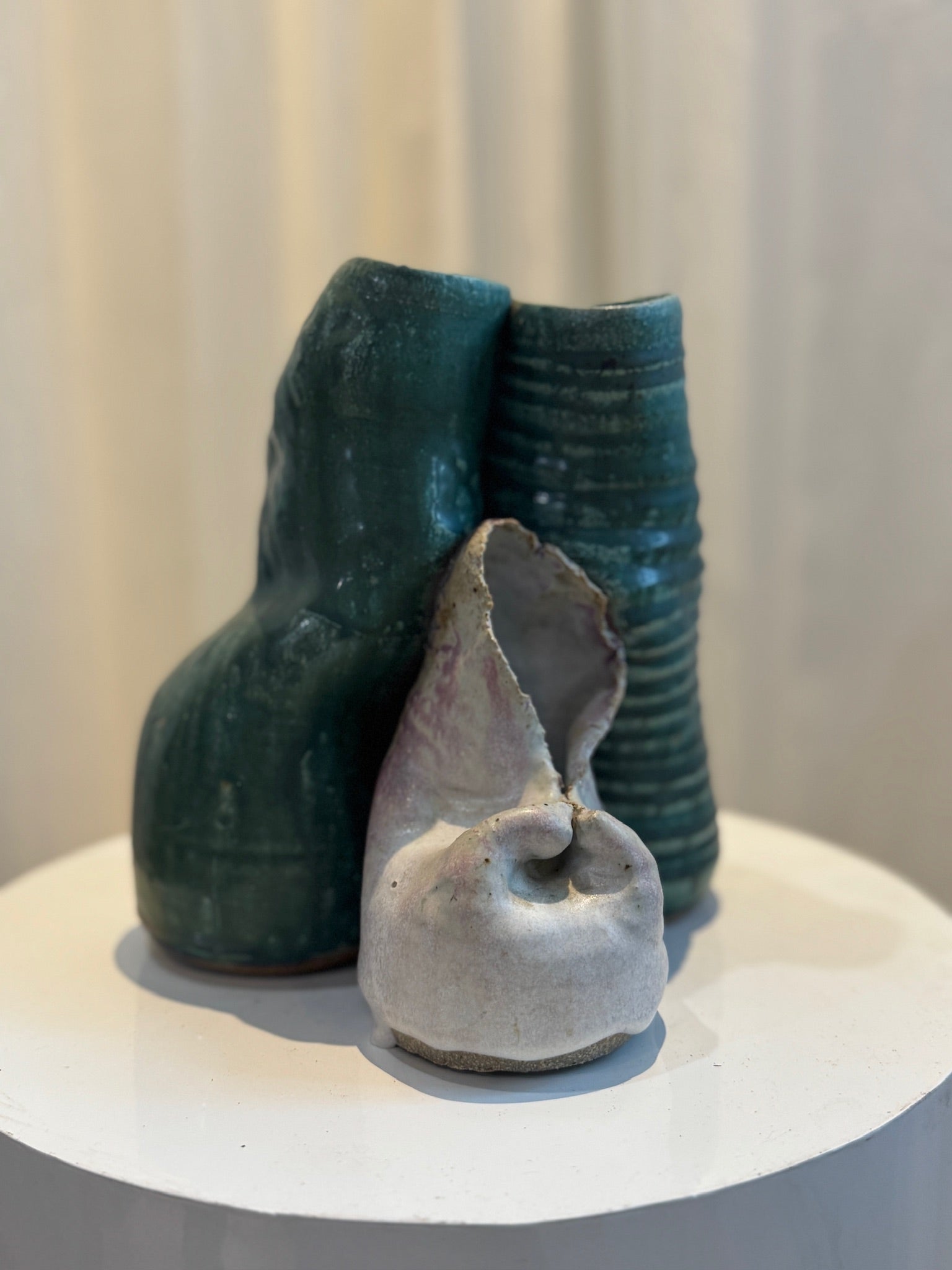 Handcrafted ceramic sculpture featuring an organic abstract form with green-glazed and off-white textural contrast, modern art piece with raw detailing — Hommes and Gardens, Pots + Planters Collection, Landscape Architect, Interior Designer, Outdoor Living, Art, Furniture, Objects, Best Gifts, Nature, Backyard, Yard, Outdoor Decorations, Home Decor, Home Design, Luxury Design.