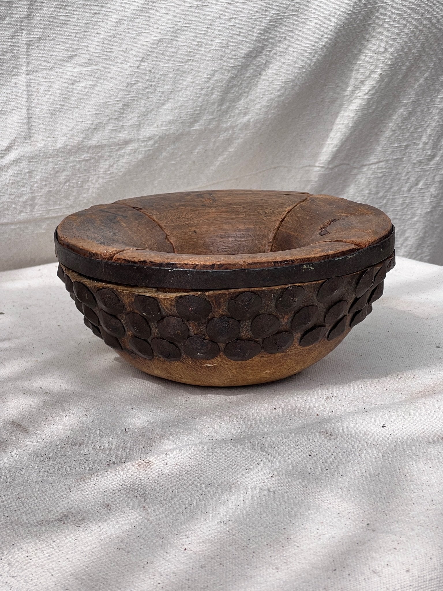 Primitive Chinese Wood & Animal Skin Bowl with intricate animal skin details and bolted metal accents, hommes + gardens estudio.