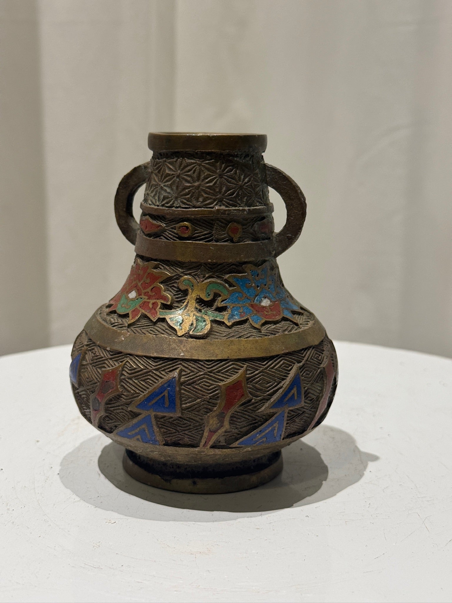 Handcrafted cloisonné brass bud vase with dual handles, detailed enamel work in blue, red, and green hues — Hommes and Gardens, Objects Collection, Landscape Architect, Interior Designer, Outdoor Living, Art, Furniture, Objects, Best Gifts, Nature, Backyard, Yard, Outdoor Decorations, Home Decor, Home Design, Luxury Design.