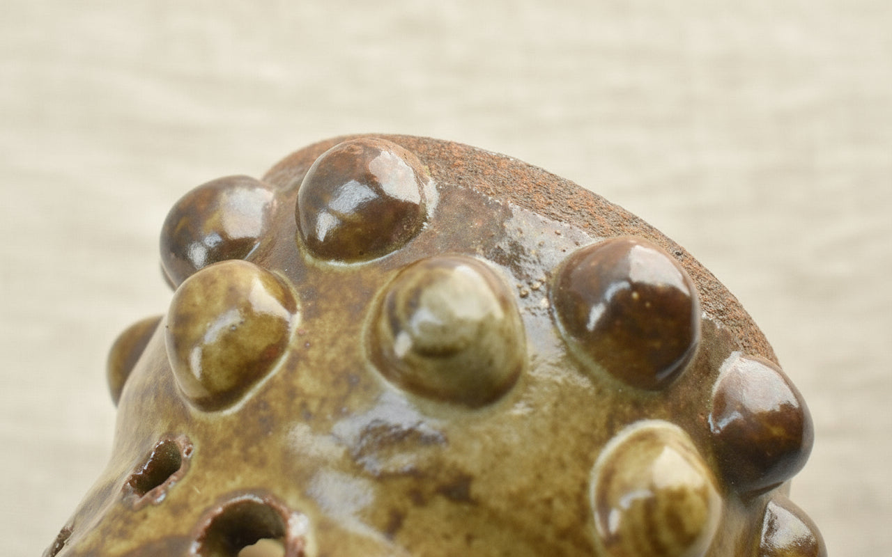 Naïve Art Pottery - Flower frog - Signed Mary, showcasing abstract design and earthy tones. hommes + gardens estudio.