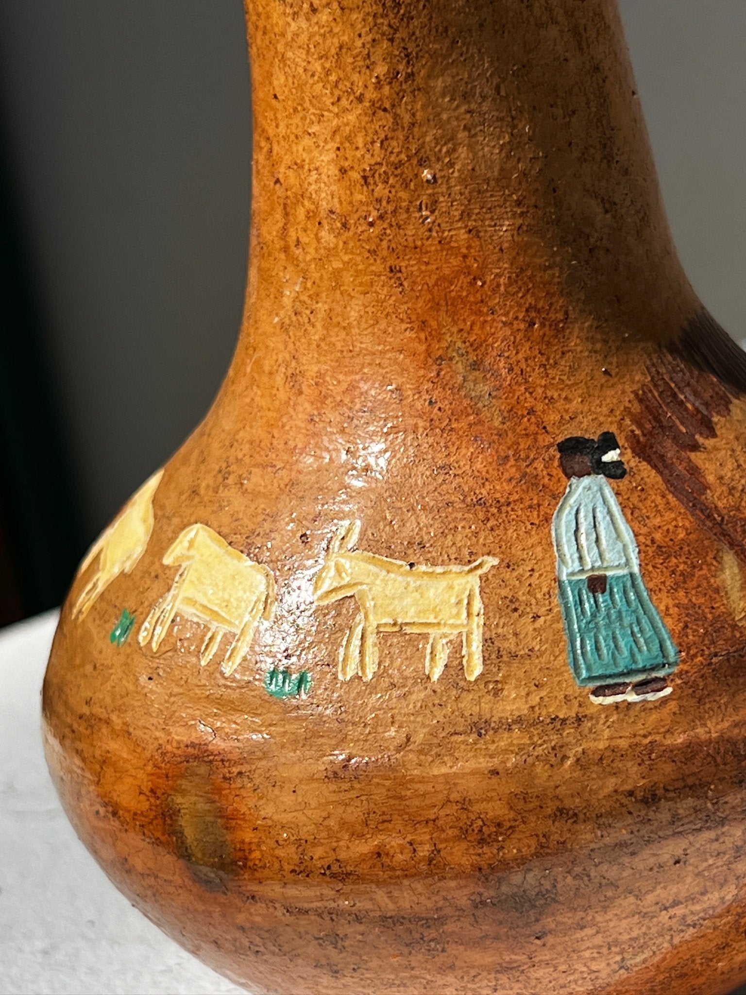 Native American Navajo pictorial pot with hand-painted designs depicting goats and a figure, homme + gardens estudio.
