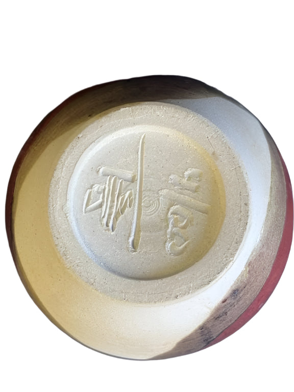 Bottom view of signed glazed stoneware vase showcasing unique artist's mark and glaze texture, hommes + gardens estudio.