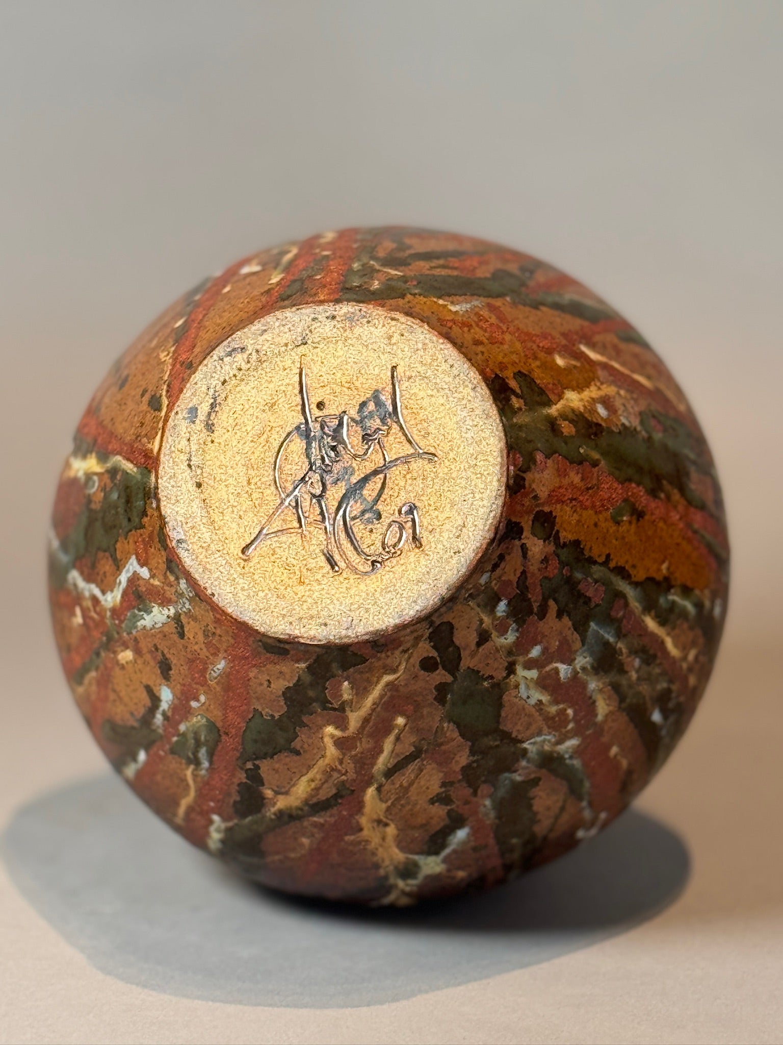 Signed Handcrafted Stoneware Vase with Rich Earthy Glaze bottom view showcasing artisan signature, hommes + gardens estudio.