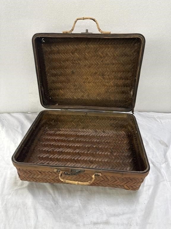 Vintage bamboo travel or picnic case with open lid showcasing interior design. hommes + gardens estudio