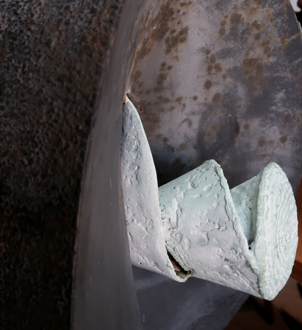 Close-up of Vintage Large Iron Abstract Sculpture showcasing intricate details and textured finishes. hommes + gardens estudio