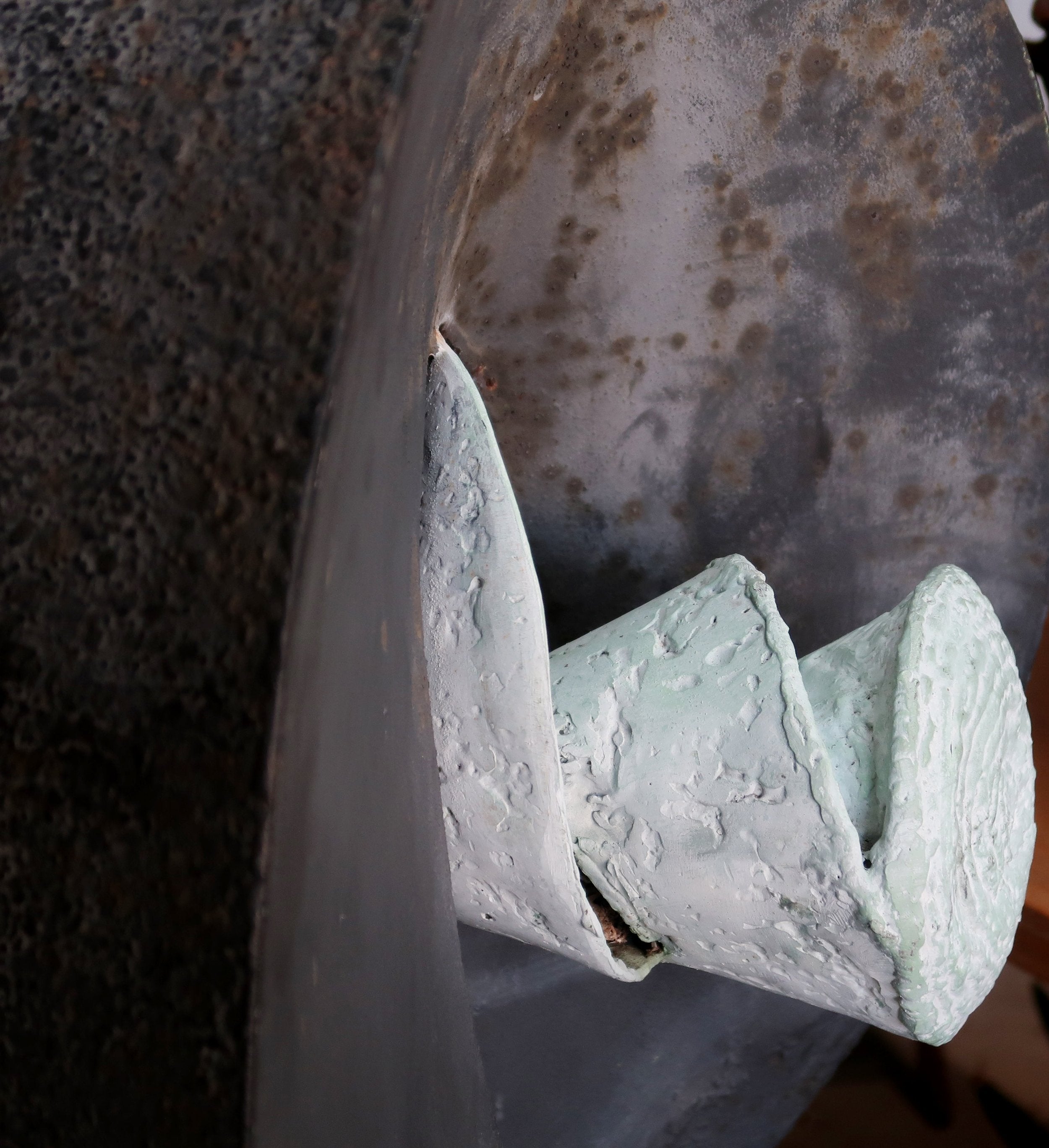 Close-up of Vintage Large Iron Abstract Sculpture showcasing intricate details and textured finishes. hommes + gardens estudio