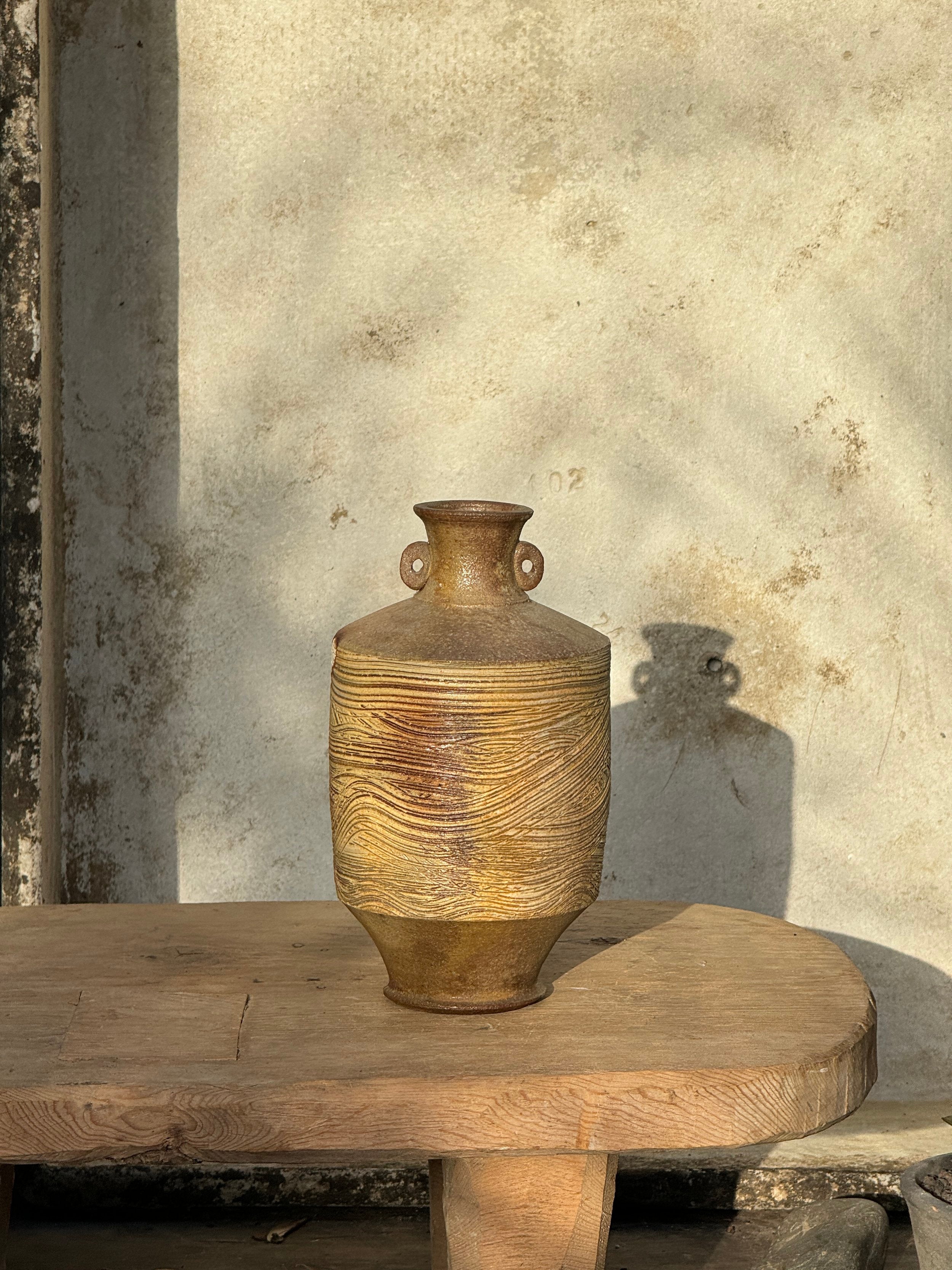 Vintage Brown Wooden Grain Etched Salt Glazed Stoneware Jug with Handles Signed displayed on a wooden table, showcasing rustic charm. hommes + gardens estudio.