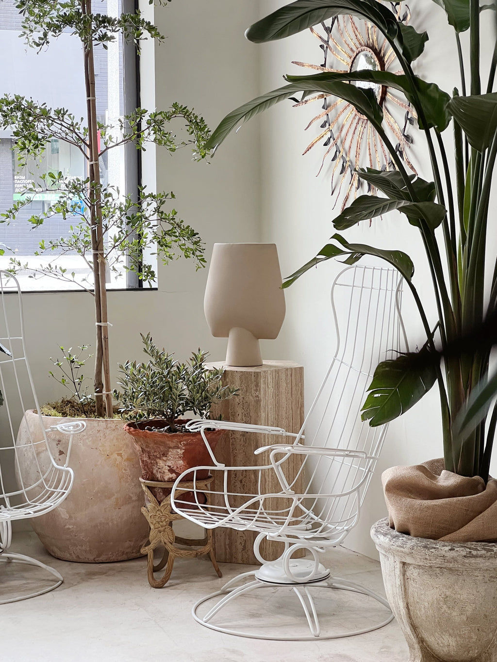 Pair of Mid-Century Modern Homecrest Siesta Swivel Rocker Patio Lounge Chairs in a stylish indoor setting with plants and decor. hommes + gardens estudio.