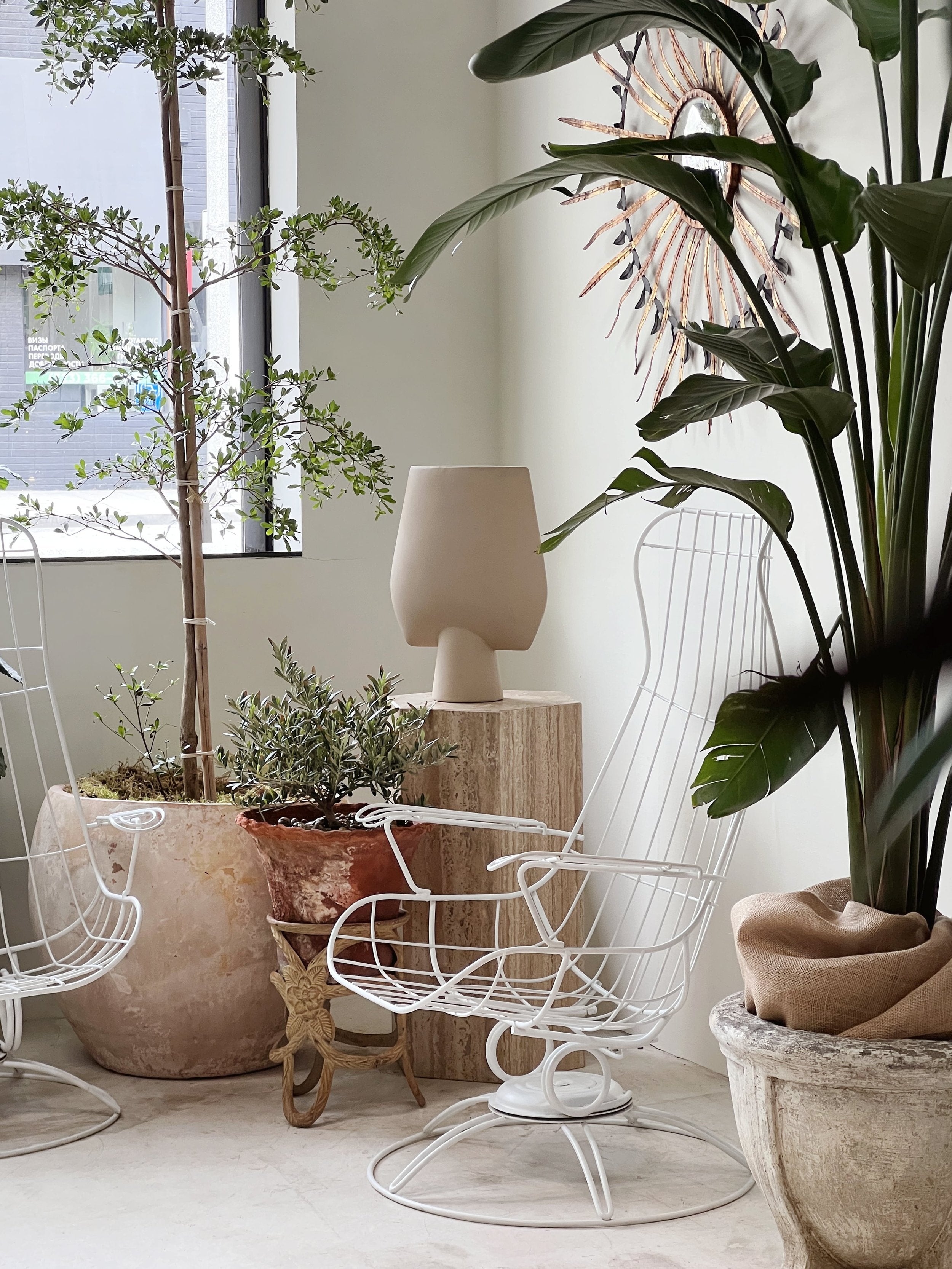 Pair of Mid-Century Modern Homecrest Siesta Swivel Rocker Patio Lounge Chairs in a stylish indoor setting with plants and decor. hommes + gardens estudio.