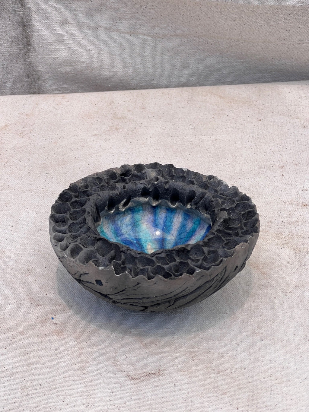 Raku Lava Bowl Vintage Volcanic Crater by Hutch Ceramics Maui showcasing unique volcanic textures and iridescent colors, hommes + gardens estudio.