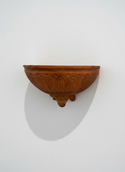 Vintage Italian terracotta wall pocket planter with handcrafted fluted design and natural weathered patina, front view — Hommes and Gardens, Pots + Vessels Collection, landscape design, plant design, Landscape Architect, Interior Designer, Outdoor Living, Outdoor Decorations, Home Design, Luxury Design, Art, Furniture, Objects, Best Gifts, Nature, Backyard, Yard.