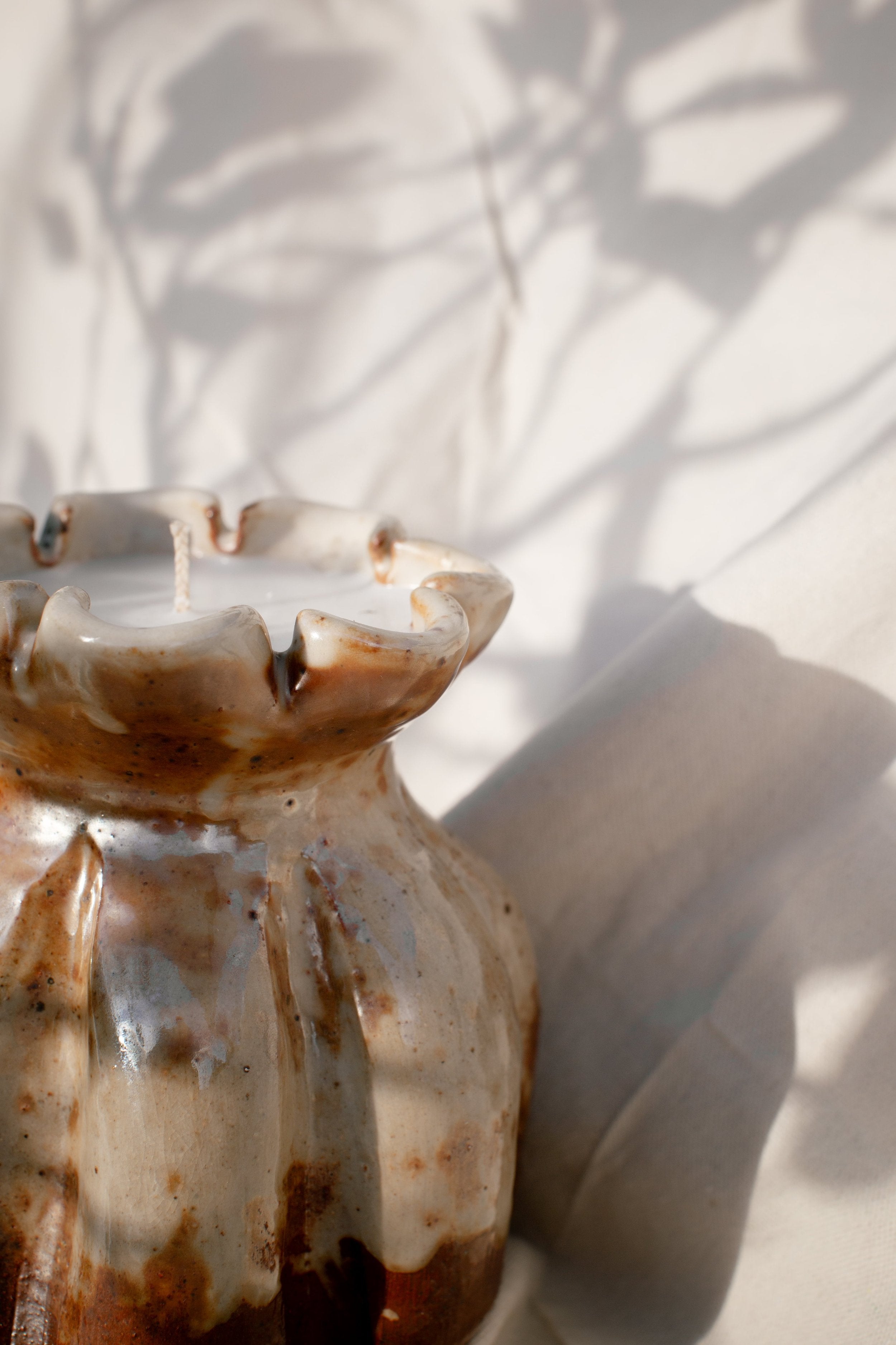 Ceramic Lotus Vase- H&G x Western Disco Candle Collaboration showcasing a handmade ceramic vase with candlelight shadows. hommes + gardens estudio.