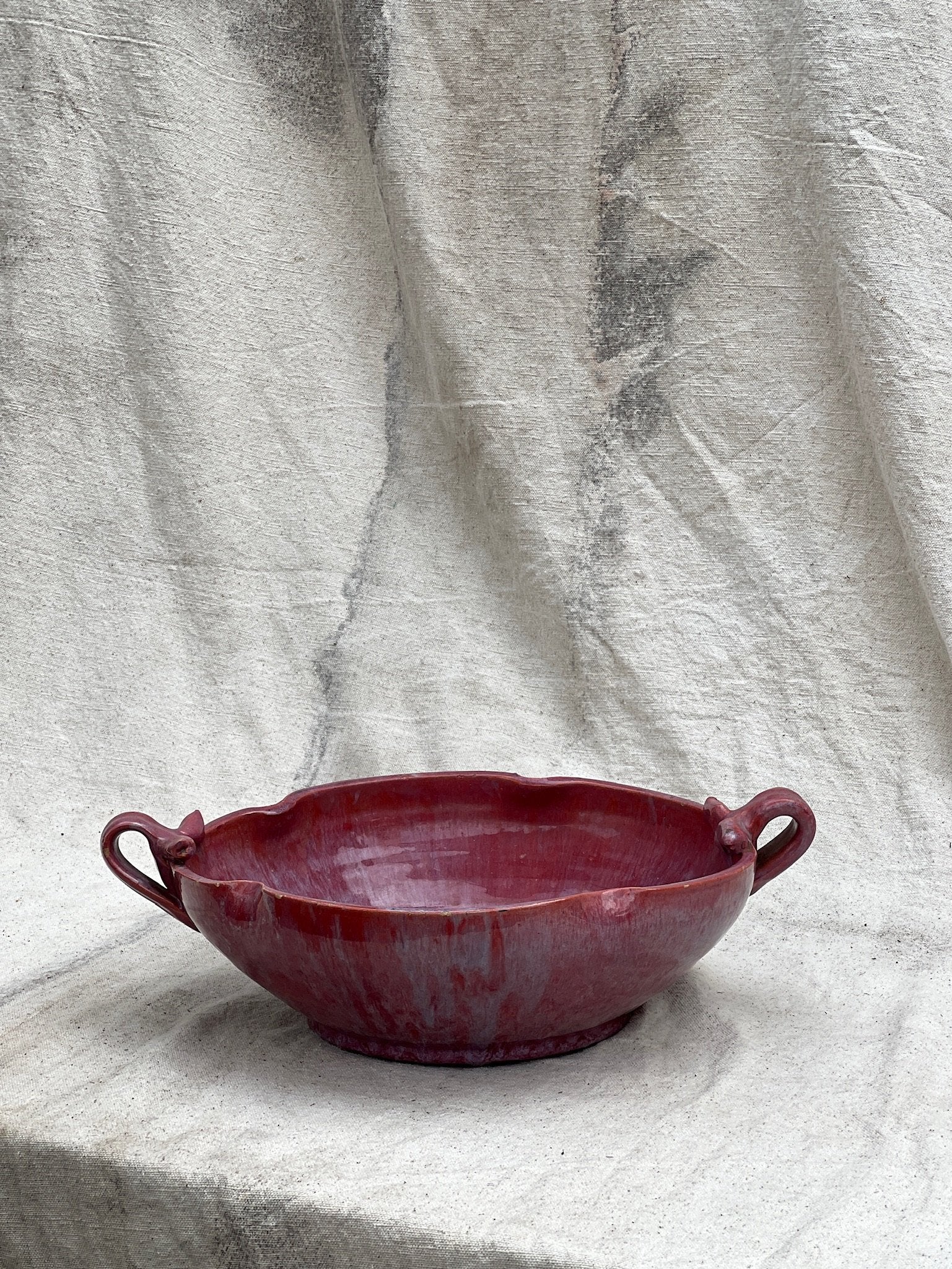 Magenta ceramic serving bowl with handles, handmade vintage pottery piece offering both beauty and functionality — Hommes and Gardens, Catchall Collection, Landscape Architect, Interior Designer, Outdoor Living, Outdoor Decorations, Home Decor, Home Design, Luxury Design, Art, Furniture, Objects, Best Gifts, Nature, Backyard, Yard.