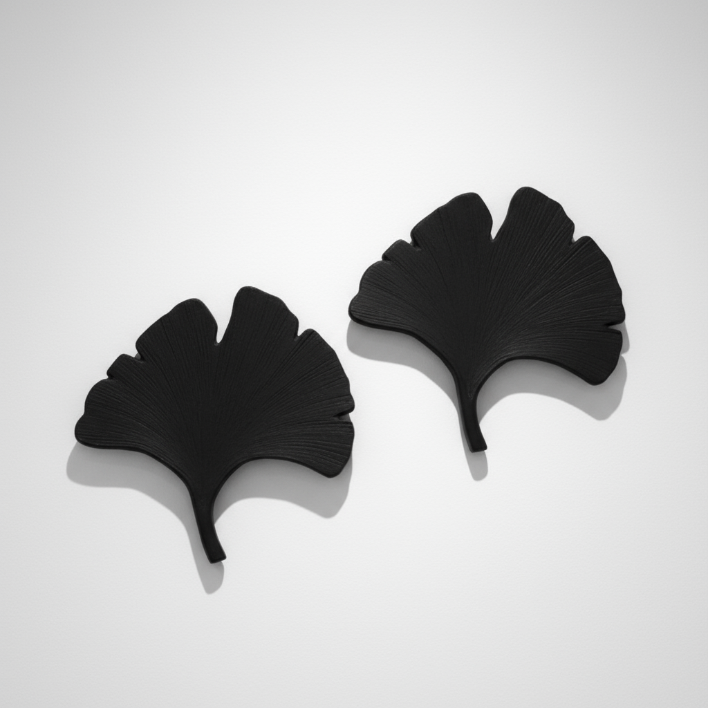 Pair of Hand-Cut Metal Palm Leaves – Decorative Patinated Steel Botanical Sculptures by hommes + gardens estudio.