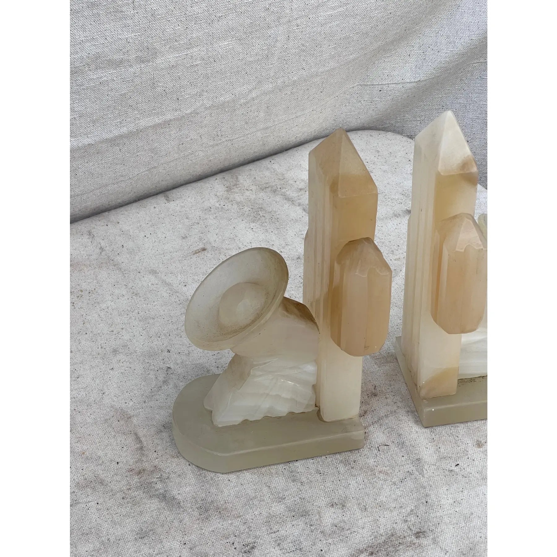 Mexican vintage white onyx bookends from the 1960s, hand-carved with smooth finish and natural stone texture, ideal decorative accents — Hommes and Gardens, Objects Collection, Landscape Architect, Interior Designer, Outdoor Living, Art, Furniture, Objects, Best Gifts, Nature, Backyard, Yard, Outdoor Decorations, Home Decor, Home Design, Luxury Design.