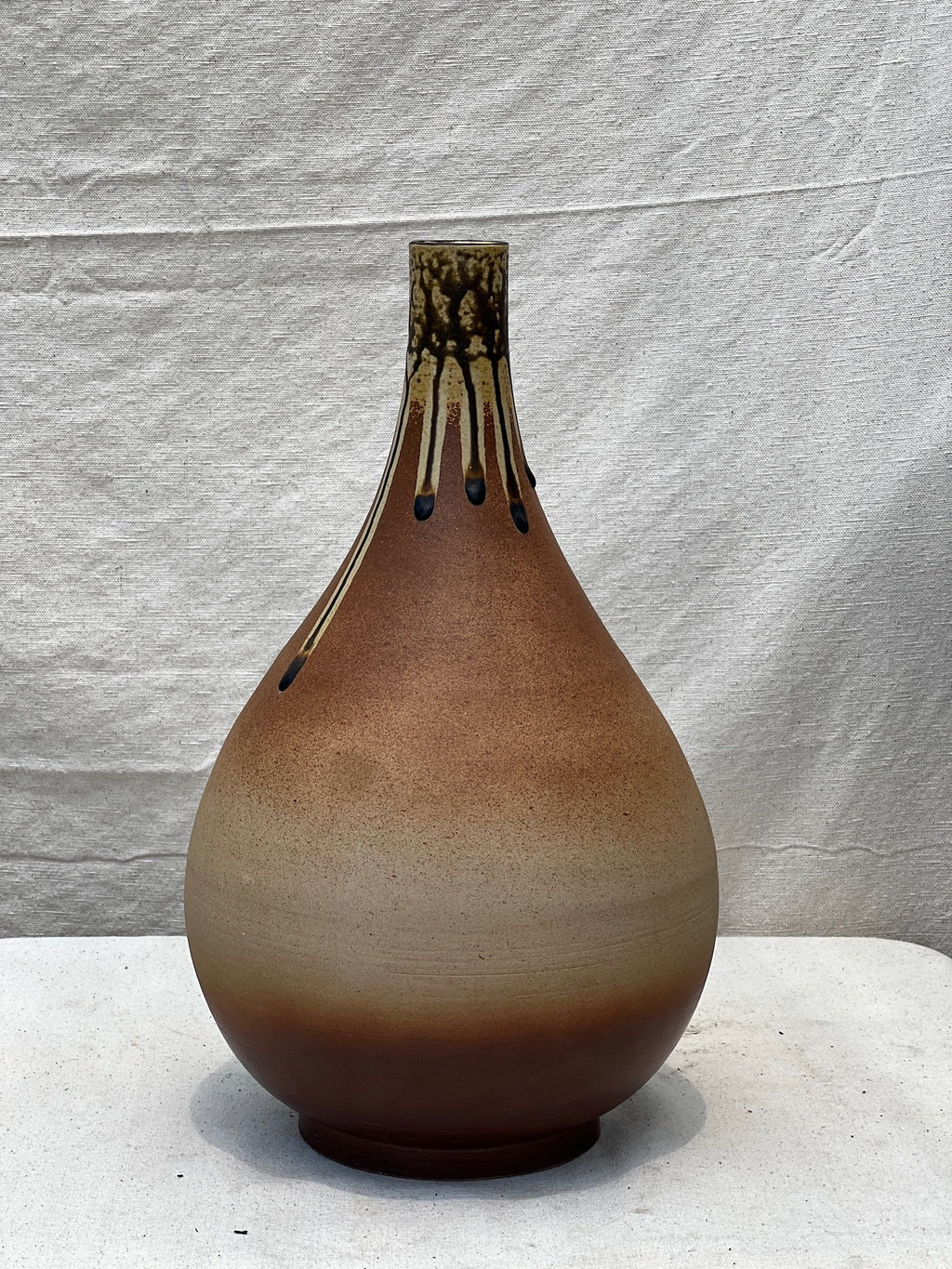 Mid-century brown teardrop pottery vase featuring elegant drip glaze and handcrafted ceramic artistry, a timeless vintage piece — Hommes and Gardens, Pots + Vessels Collection, Landscape Architect, Interior Designer, Outdoor Living, Outdoor Decorations, Home Decor, Home Design, Luxury Design, Art, Furniture, Objects, Best Gifts, Nature, Backyard, Yard.
