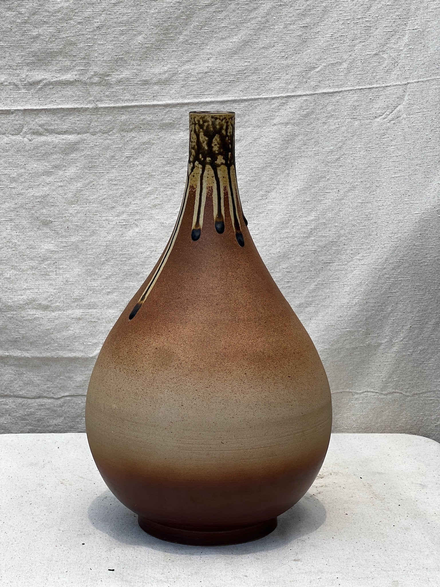 Mid-century brown teardrop pottery vase featuring elegant drip glaze and handcrafted ceramic artistry, a timeless vintage piece — Hommes and Gardens, Pots + Vessels Collection, Landscape Architect, Interior Designer, Outdoor Living, Outdoor Decorations, Home Decor, Home Design, Luxury Design, Art, Furniture, Objects, Best Gifts, Nature, Backyard, Yard.