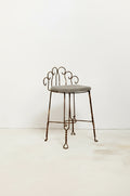 Mid-century Hollywood Regency wrought iron vanity stool or plant stand with intricate detailing, combining vintage glamour and timeless craftsmanship — Hommes and Gardens, Furniture Collection, Home Decor, Outdoor Decorations, Landscape Architect, Interior Designer, Outdoor Living, Home Design, Luxury Design, Art, Furniture, Objects, Best Gifts, Nature, Backyard, Yard.