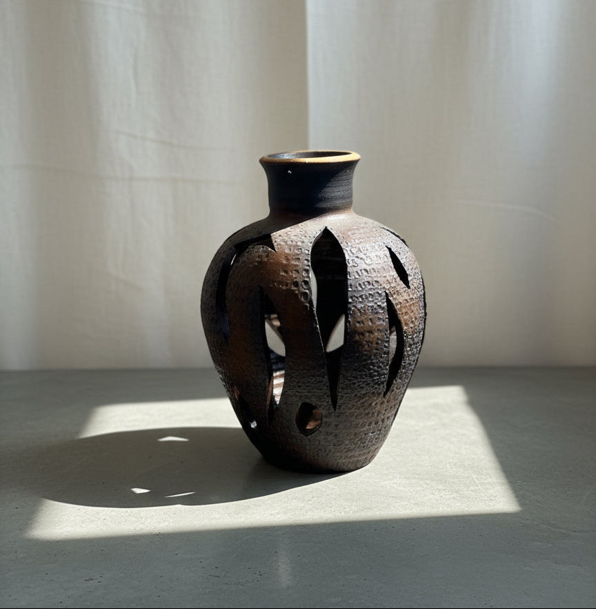 Mid-century modern ceramic vase in the style of David Cressey, featuring sculptural cutout design and earthy brown glaze, a striking openwork pottery piece — Hommes and Gardens, Objects + Vases & Vessels Collection, Landscape Architect, Interior Designer, Outdoor Living, Art, Furniture, Objects, Best Gifts, Nature, Backyard, Yard, Outdoor Decorations, Home Decor, Home Design, Luxury Design.