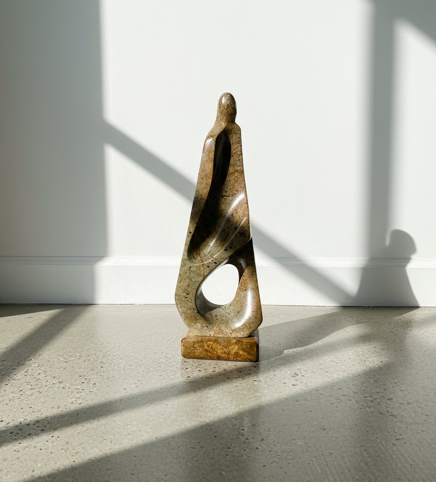 Mid-century modern soapstone sculpture titled “Lyra,” signed by artist Marco Lyra, featuring an abstract human form on a soapstone base — Hommes and Gardens, Objects Collection, Landscape Architect, Interior Designer, Outdoor Living, Outdoor Decorations, Home Decor, Home Design, Luxury Design, Art, Furniture, Objects, Best Gifts, Nature, Backyard, Yard.