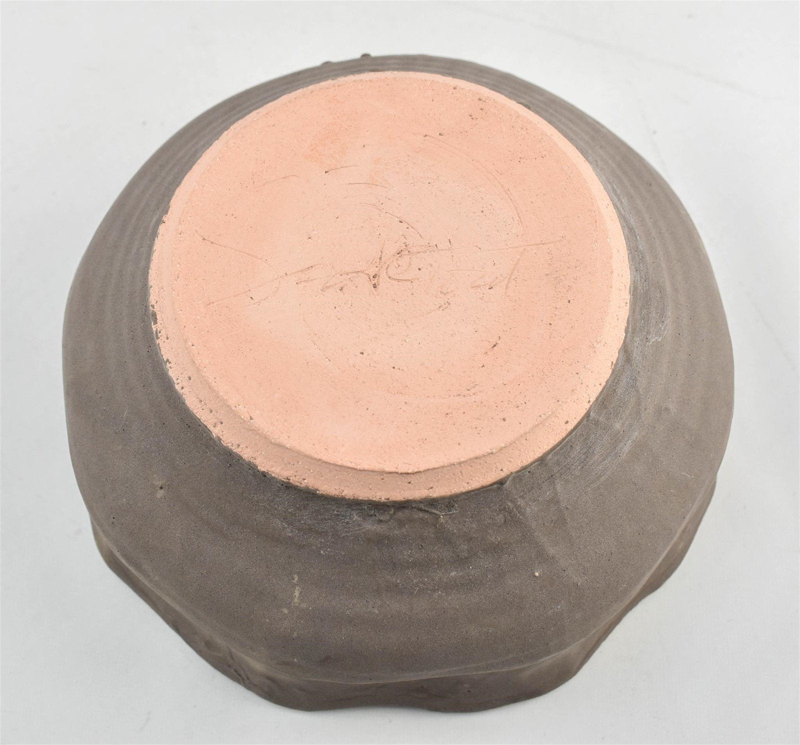 Modern handmade gray clay bowl with unique irregular rim and artisan texture, signed by the maker — Hommes and Gardens, Catchall Collection, home decor, outdoor decorations, home design, luxury design, Landscape Architect, Interior Designer, Outdoor Living, Art, Furniture, Objects, Best Gifts, Nature, Backyard, Yard.