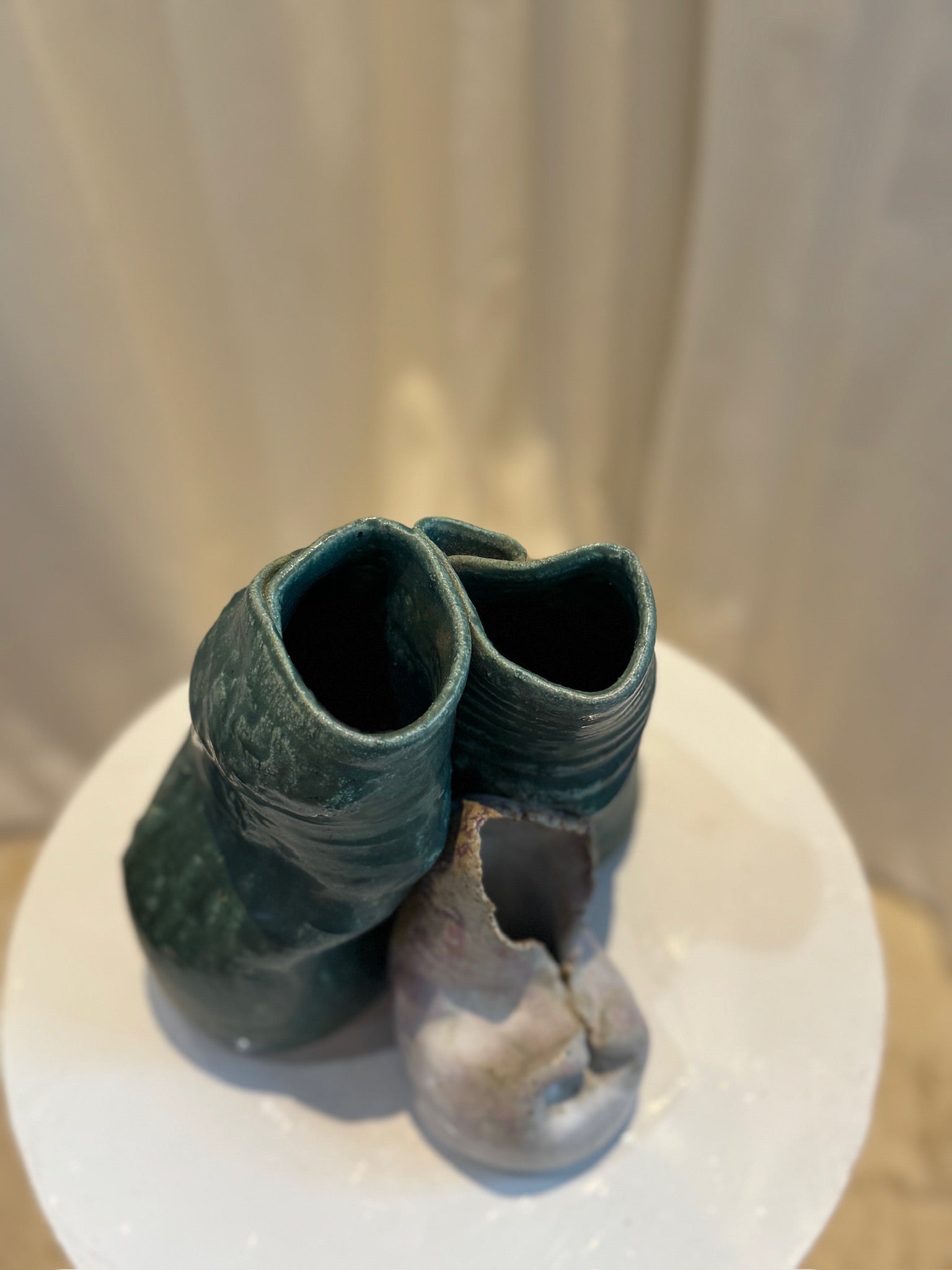 Modern handcrafted ceramic sculpture with trio vessel design, featuring textured green glaze and contrasting off-white section, abstract art pottery — Hommes and Gardens, Pots + Planters Collection, Landscape Architect, Interior Designer, Outdoor Living, Art, Furniture, Objects, Best Gifts, Nature, Backyard, Yard, Outdoor Decorations, Home Decor, Home Design, Luxury Design.