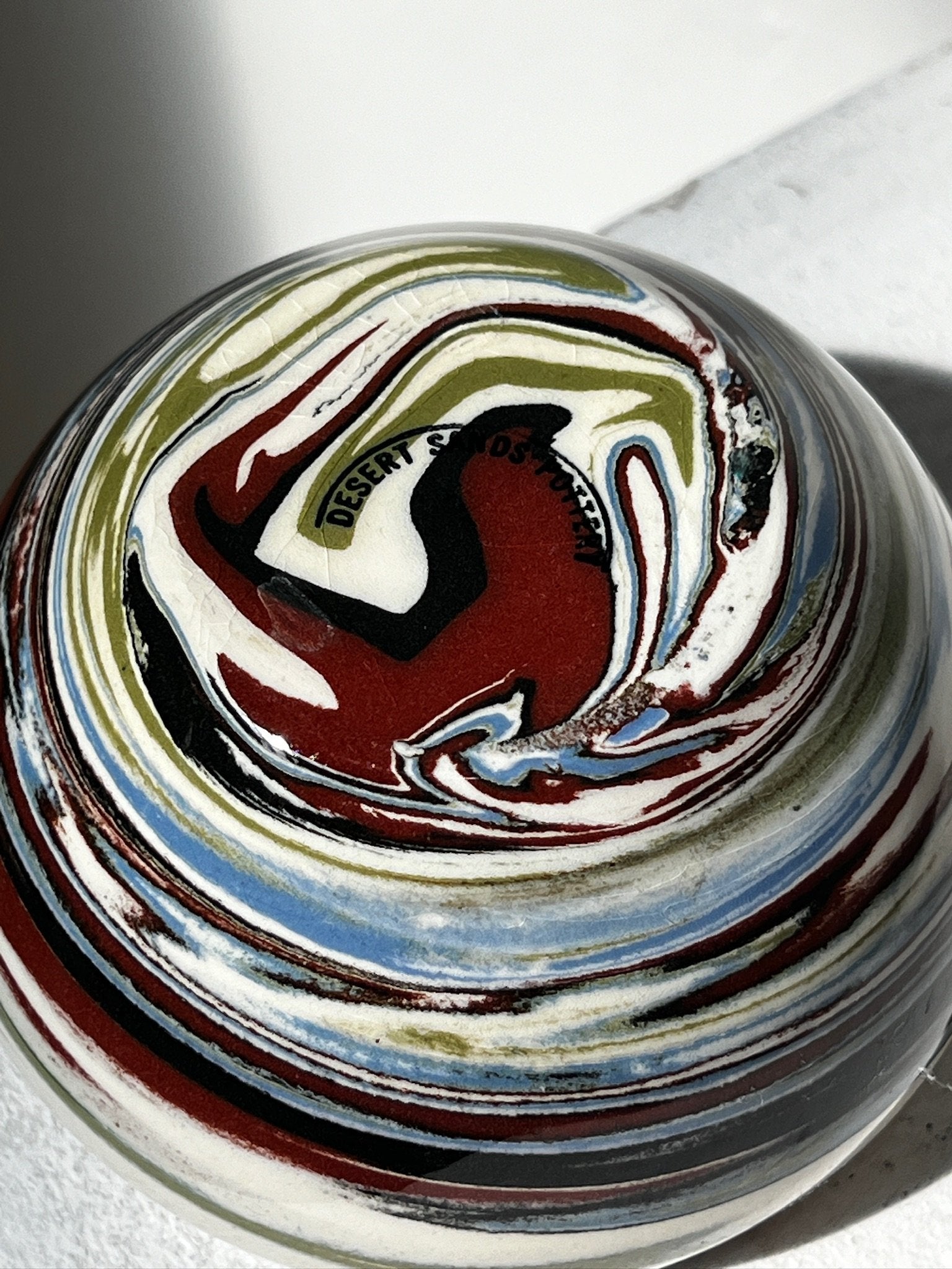 Vintage Multicolor Desert Sands Pottery Bowl with abstract marbled patterns, showcasing unique artistry. hommes + gardens estudio