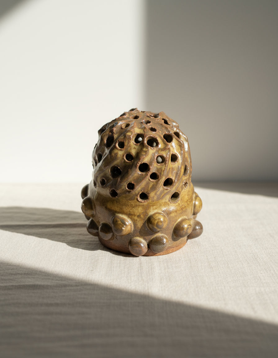 Naïve Art Pottery -  Flower frog - Signed Mary showcasing a whimsical design and intricate carved holes. hommes + gardens estudio.