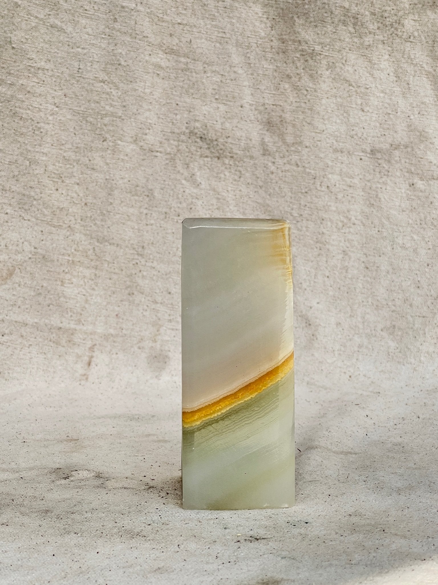 Carved Onyx Stone Bookend (Single) displaying elegant layers of onyx, perfect for organizing books, hommes + gardens estudio.