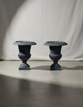 Pair of early 20th-century French Neoclassical cast iron urn planters with antique charcoal patina, exuding timeless elegance for indoor or outdoor spaces — Hommes and Gardens, Pots + Vessels Collection, Landscape Architect, Interior Designer, Outdoor Living, Outdoor Decorations, Home Decor, Home Design, Luxury Design, Art, Furniture, Objects, Best Gifts, Nature, Backyard, Yard.