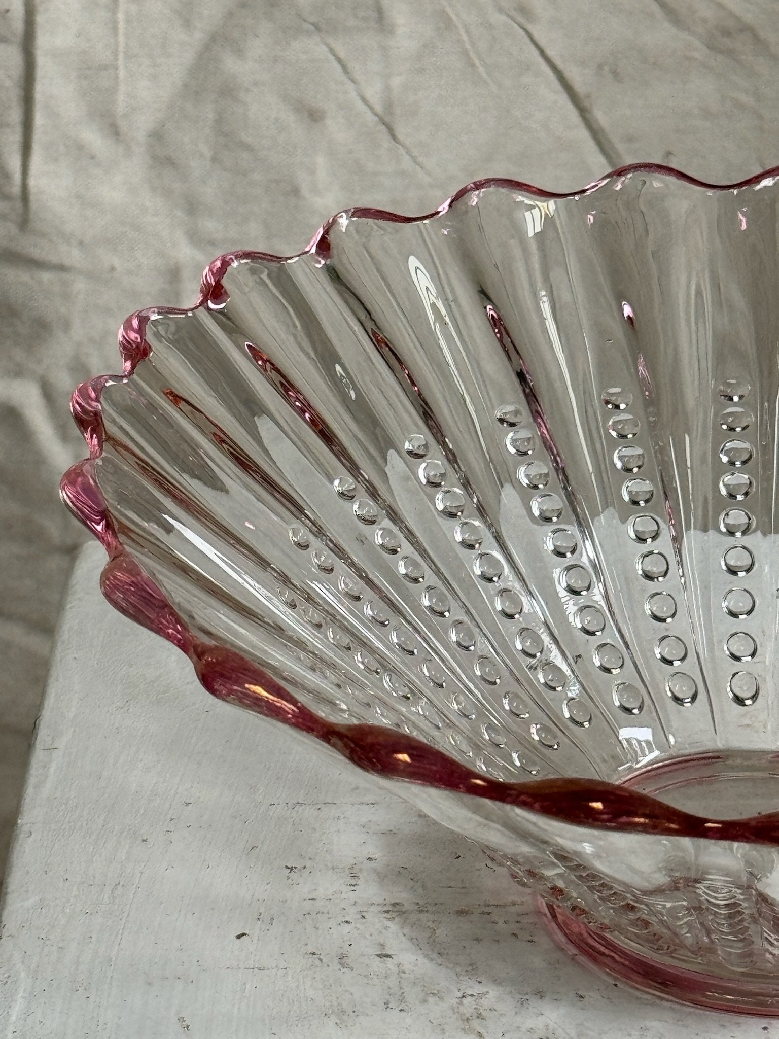 Vintage Depression Oyster And Pearl Pink bowl showcasing its elegant scalloped design and classic pattern. hommes + gardens estudio.