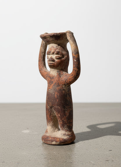 Side angle of Pre-Columbian terracotta ritual figure with raised arms holding an offering bowl, showing weathered brown surface and handmade details — Hommes and Gardens, Home Decor, landscape design, plant design, Landscape Architect, Interior Designer, Outdoor Living, Outdoor Decorations, Home Design, Luxury Design, Art, Furniture, Objects, Best Gifts, Nature, Backyard, Yard.
