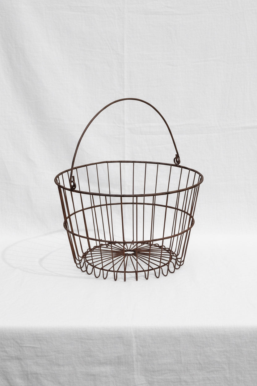 Primitive Egg Gathering Wire Basket for collecting eggs and vegetables, rustic design perfect for farmhouse decor. hommes + gardens estudio.