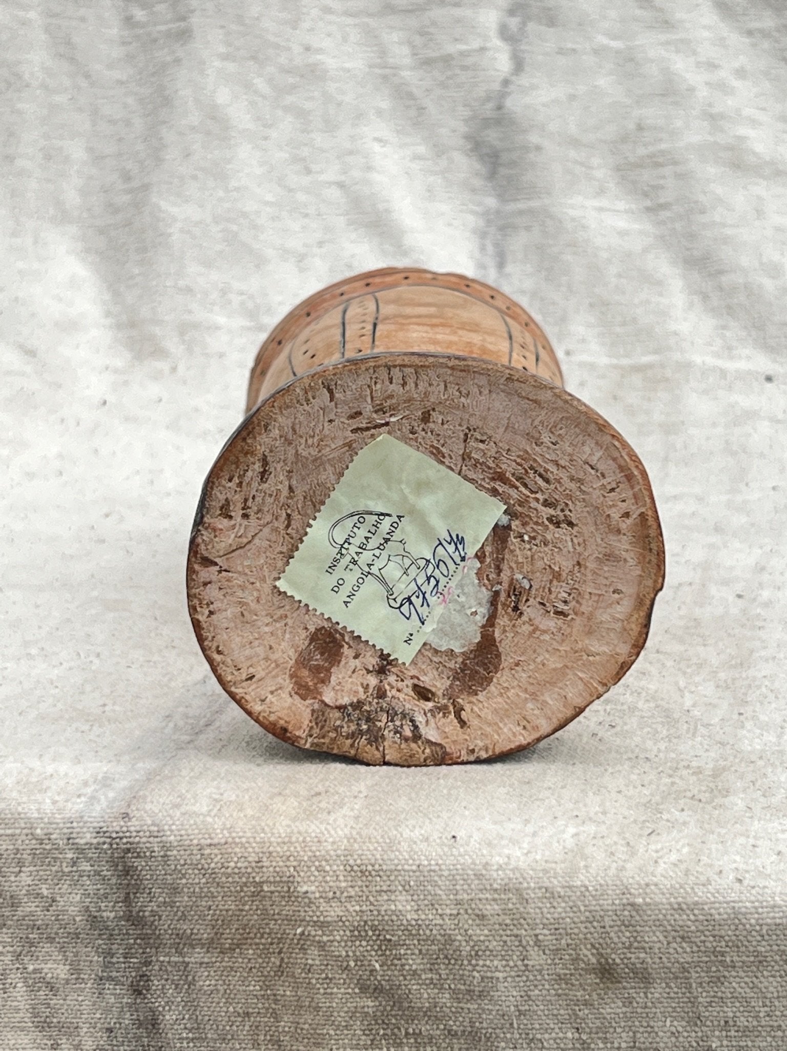 Base view of a Pair of Vintage Wooden Goblets with Hand Carved Primitive Illustrations showing the unique wood texture and engraving. hommes + gardens estudio.